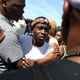 Stevante Clark, whose brother Stephon was shot and killed by Sacramento, Calif., police, reacts as he meets with mourners outside of the funeral services for Stephon Clark at the Bayside of South Sacramento Church on March 29, 2018, in Sacramento, Calif.